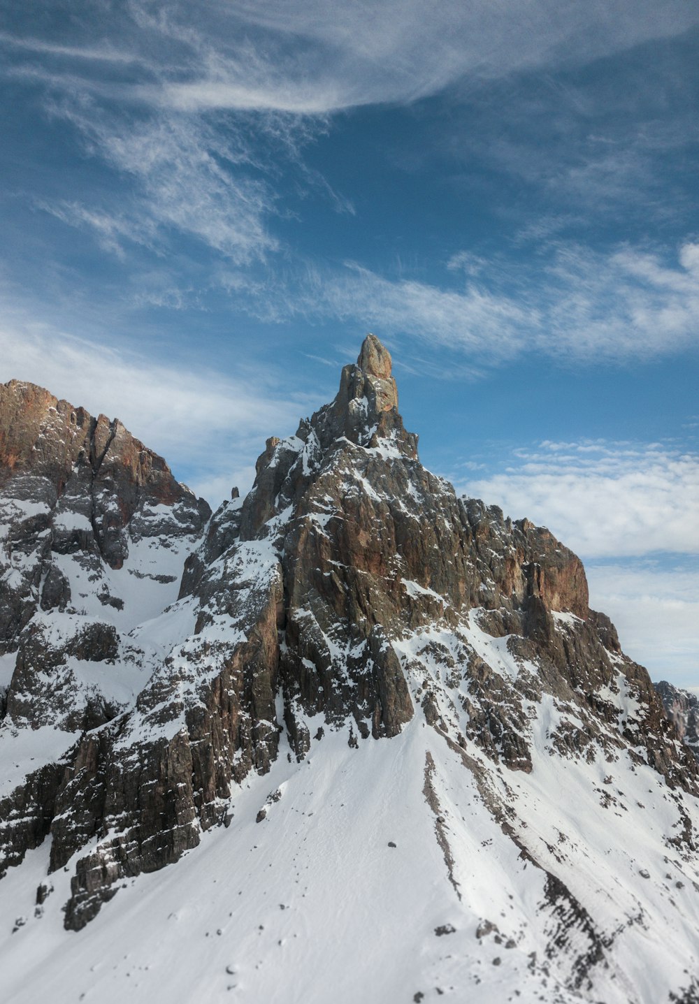 snow covered mountain under blue sky during daytime