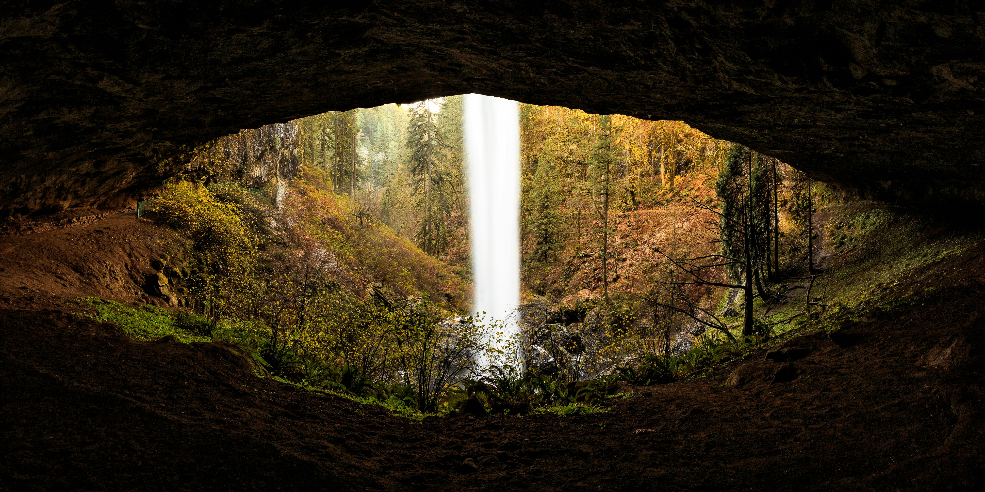 waterfalls in the middle of the forest during daytime