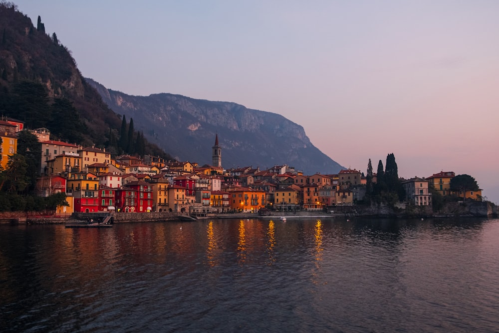 city buildings near body of water during daytime