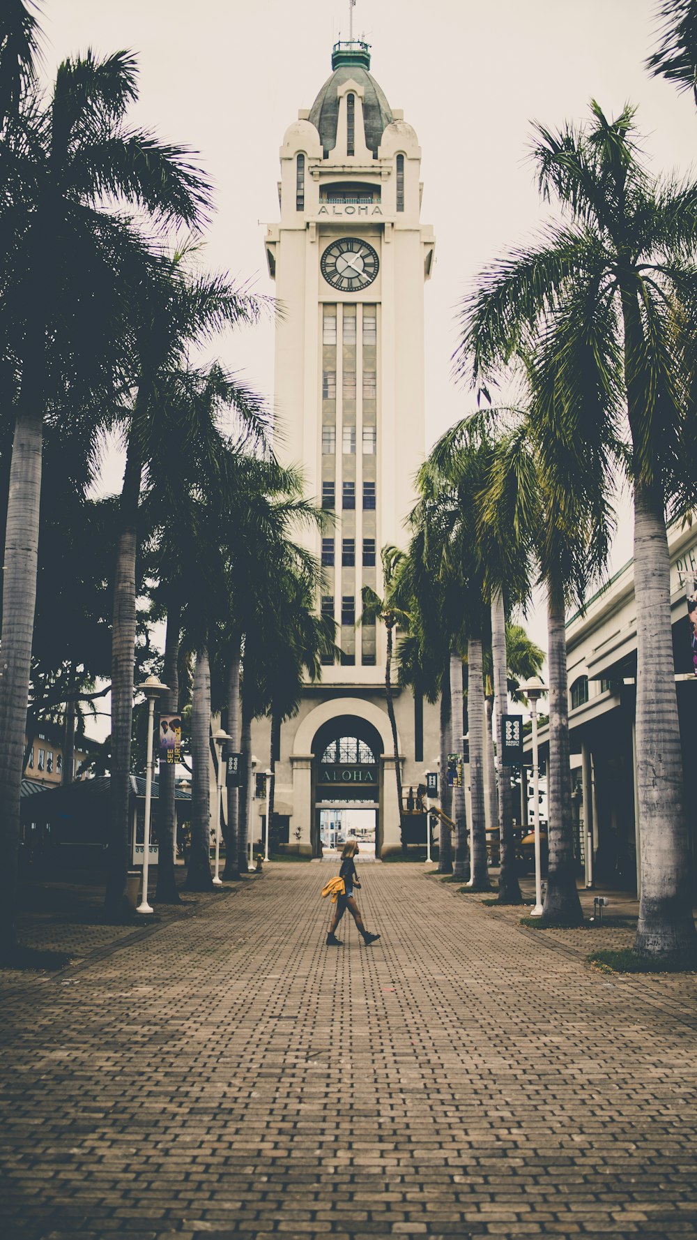 people walking on sidewalk near building during daytime