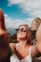 woman in white tank top wearing black sunglasses