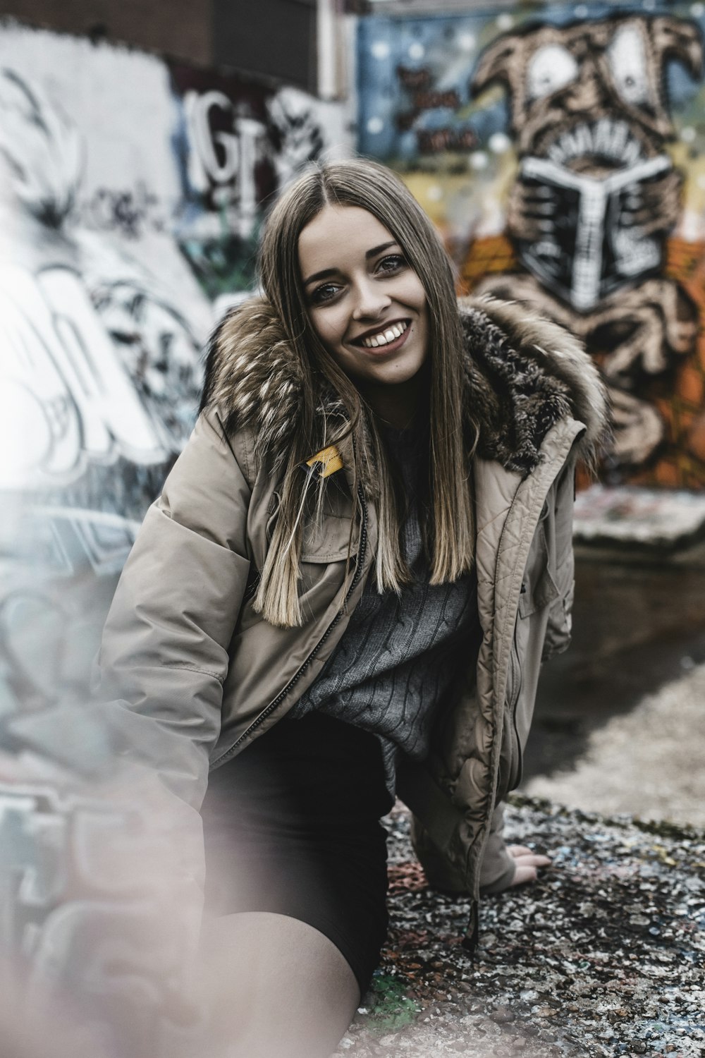 woman in brown jacket and black pants