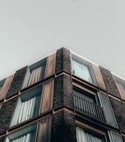Exterior view of a building facade after renovation with new windows installed.