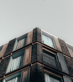Exterior view of a building facade after renovation with new windows installed.