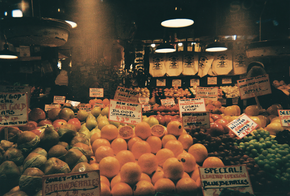 orange fruit on display during daytime