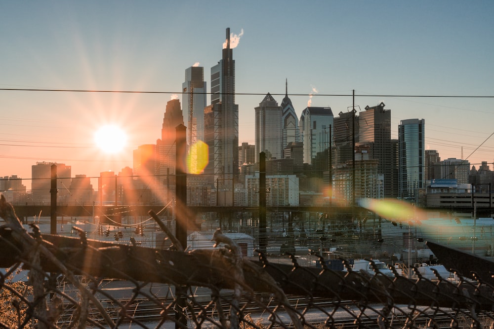 city skyline during sunset with rainbow