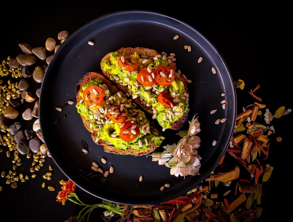 vegetable salad on black plate