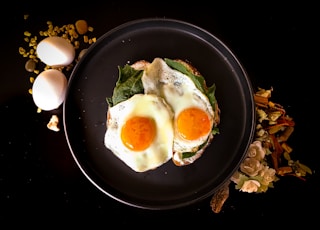 sunny side up egg on black ceramic plate