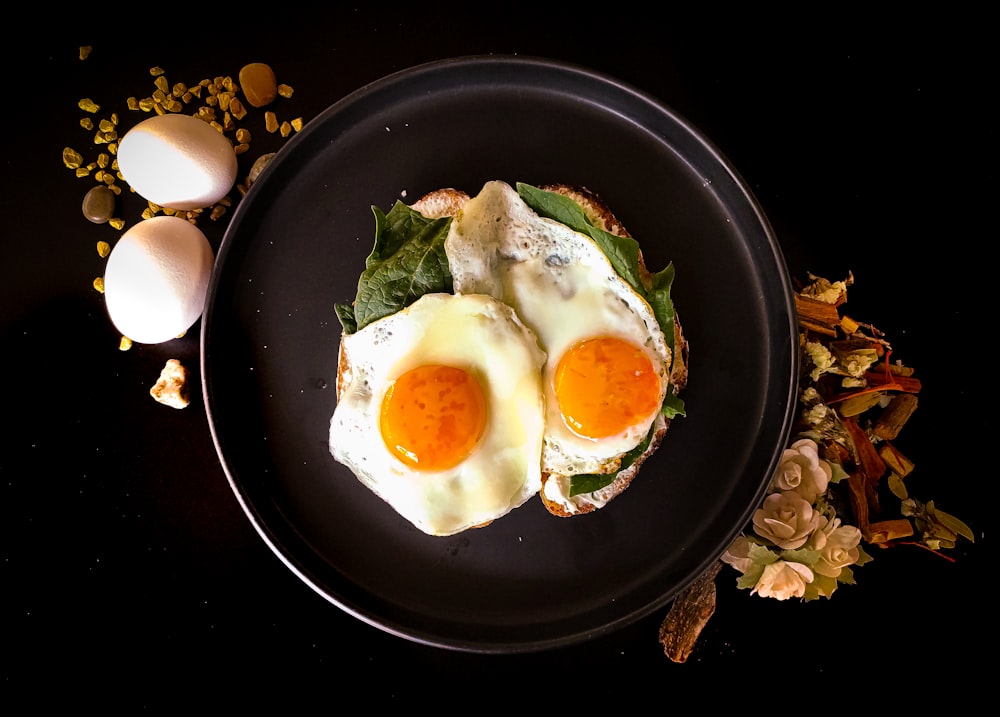 sunny side up egg on black ceramic plate