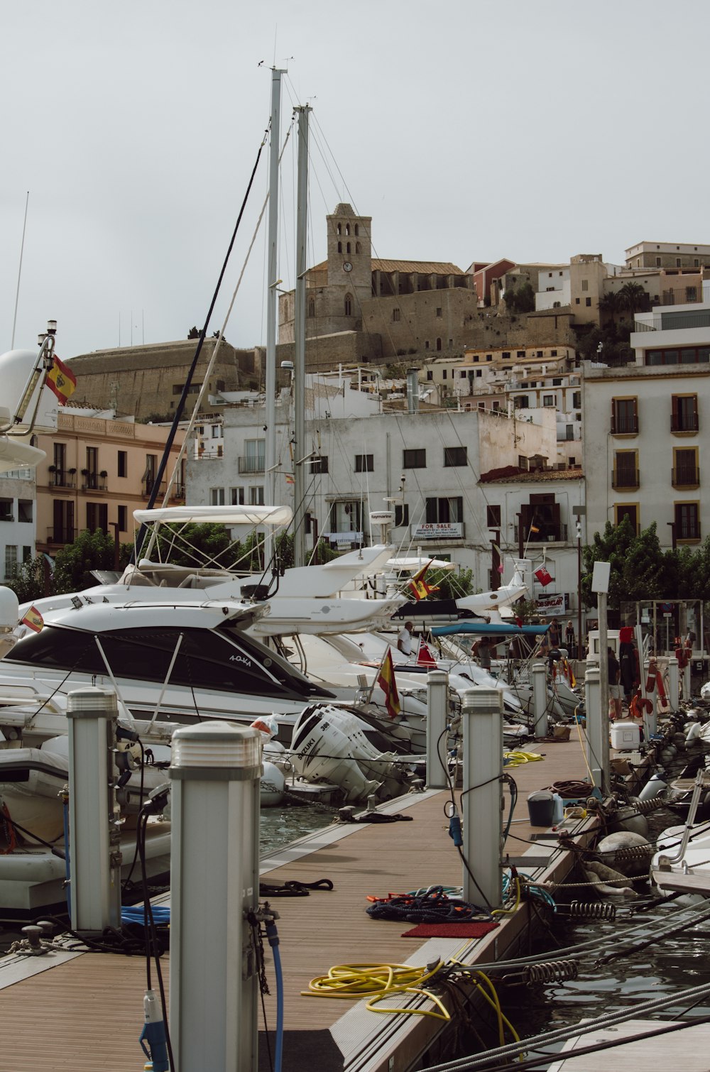 white yacht on dock during daytime