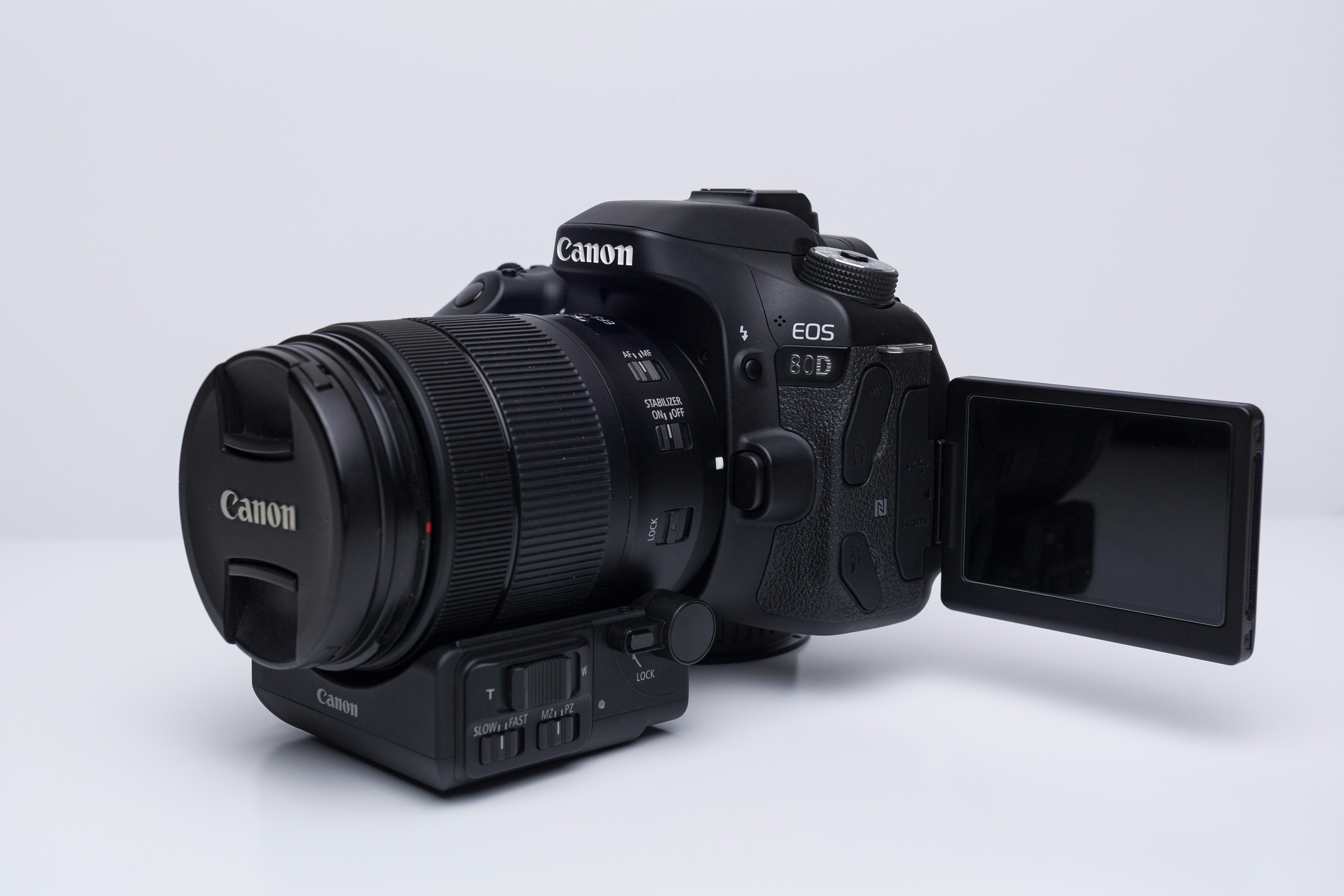 black nikon dslr camera on white surface highkey teams background