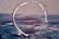 Soft watercolor brushstroke background behind a stylized speech bubble.