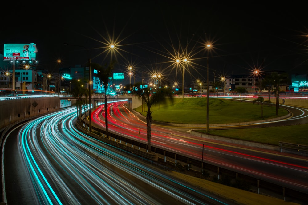 time lapse photography of cars on road during night time