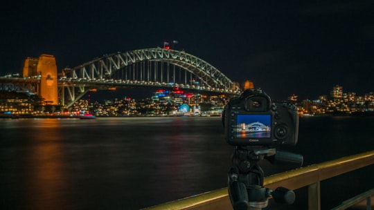 black and blue digital camera on tripod in Sydney Harbour Bridge Australia