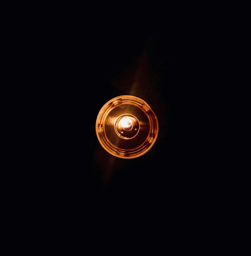 round brown light in dark room