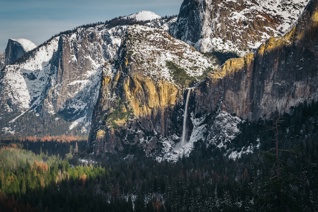 brown and white mountain with waterfalls