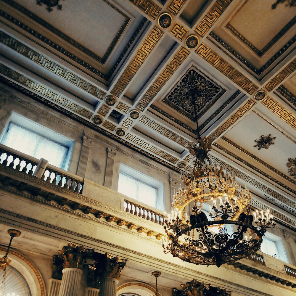 gold uplight chandelier on ceiling