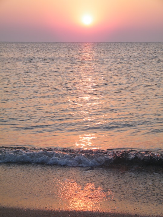 ocean waves crashing on shore during sunset in Byala Bulgaria