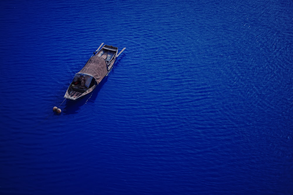 aerial view of boat on body of water during daytime