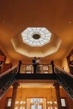A sophisticated couple enjoying a private balcony view on a luxury cruise.