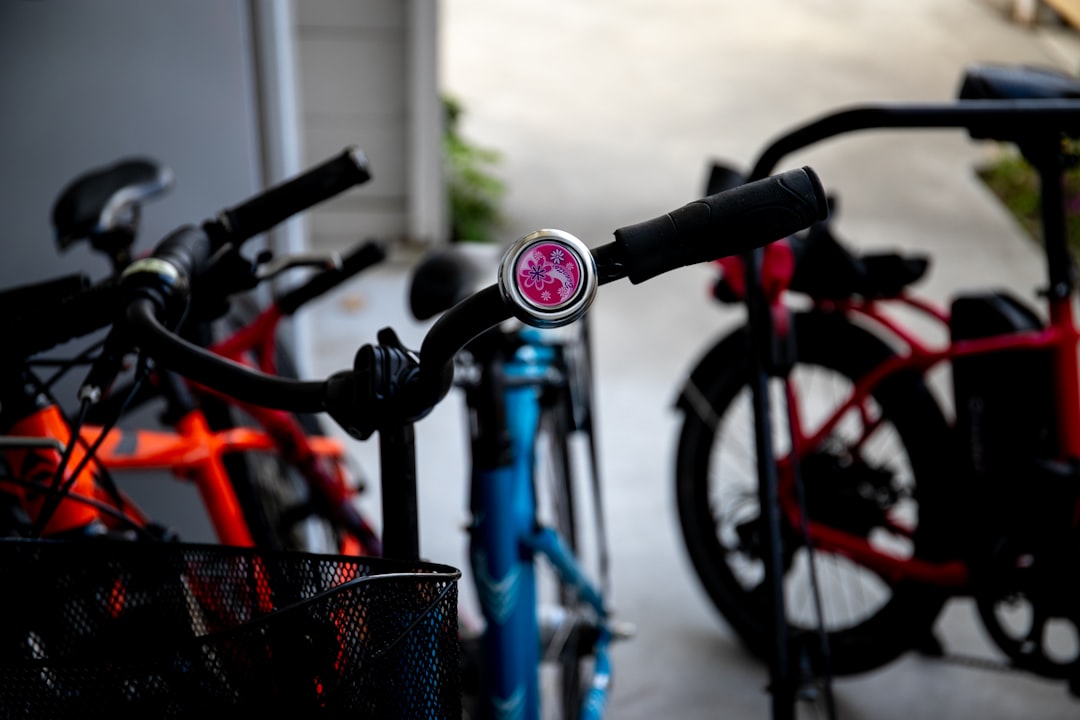 black and red bicycle with basket on top