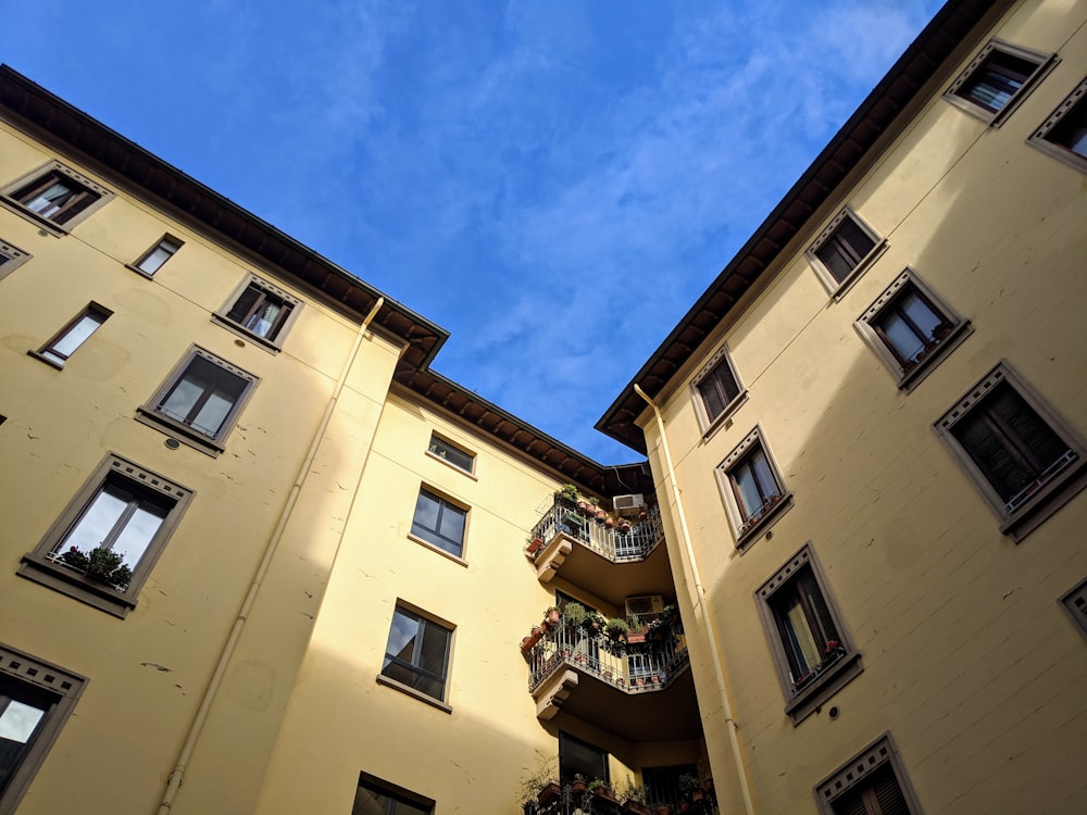 beige concrete building under blue sky during daytime