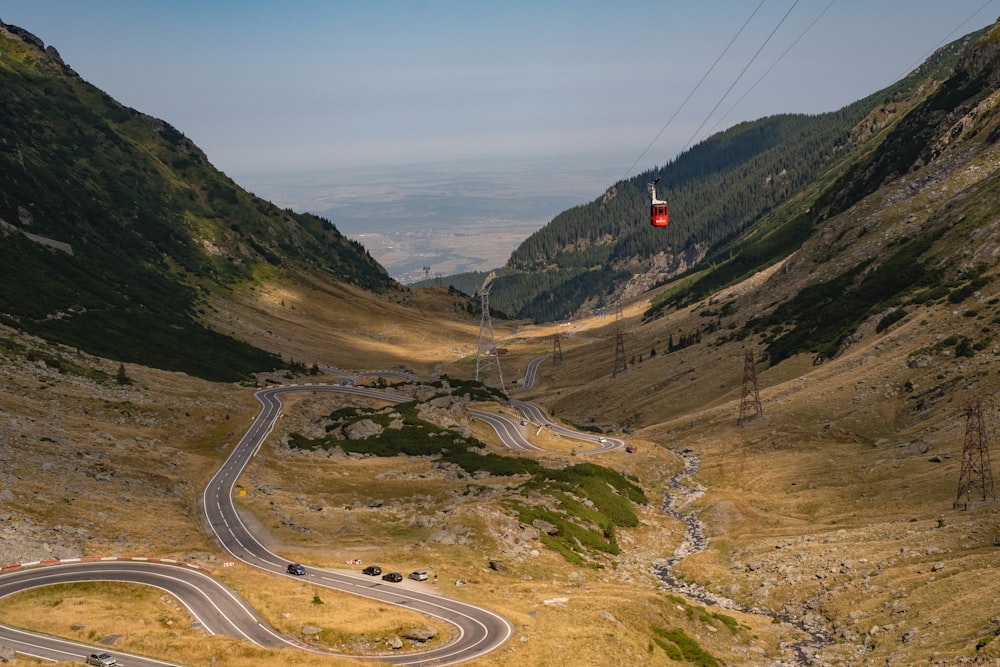 black car on road near mountains during daytime