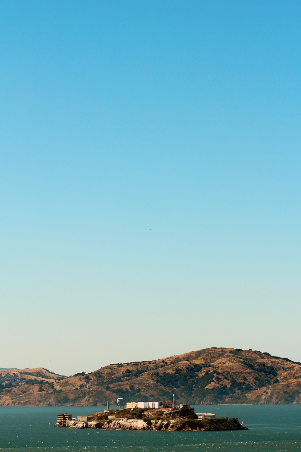 brown mountain under blue sky during daytime