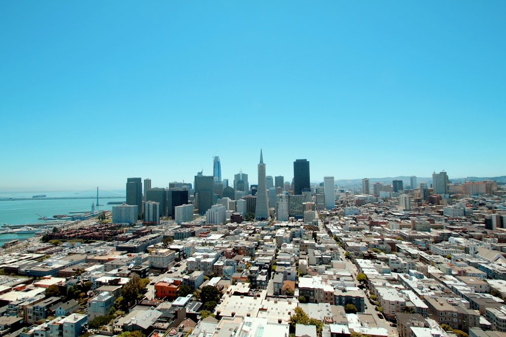 city buildings under blue sky during daytime