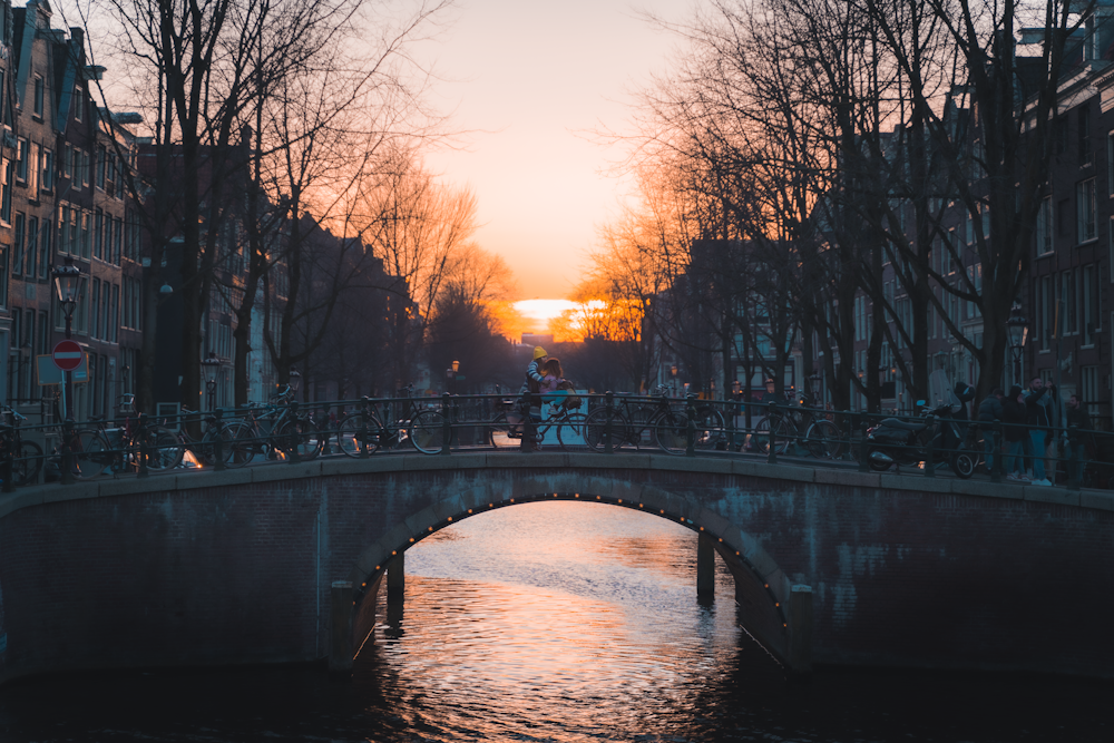 bridge over river during sunset