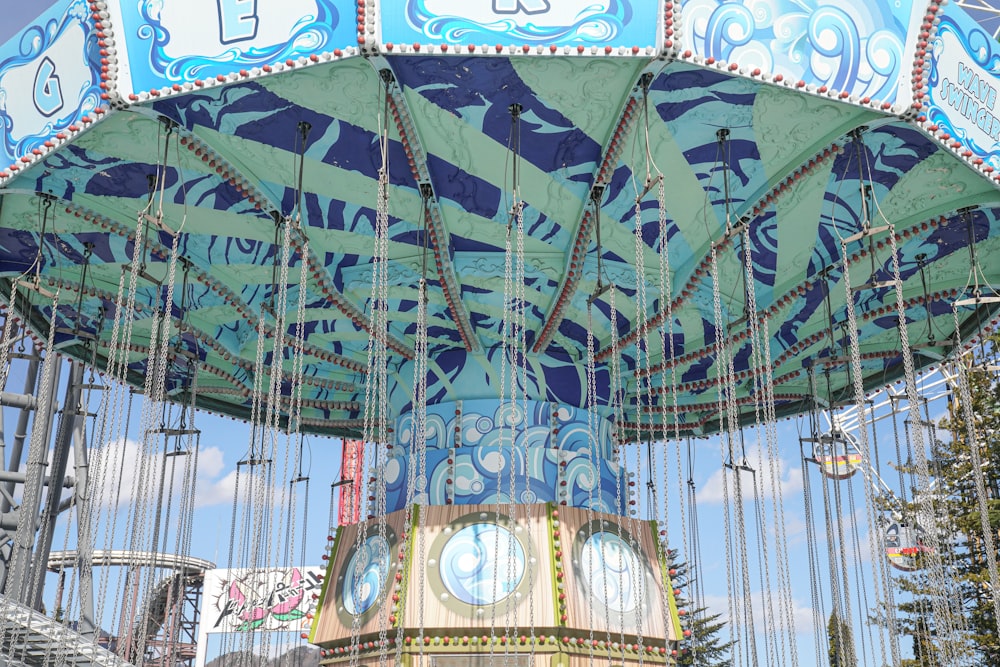 blue and white carousel during daytime
