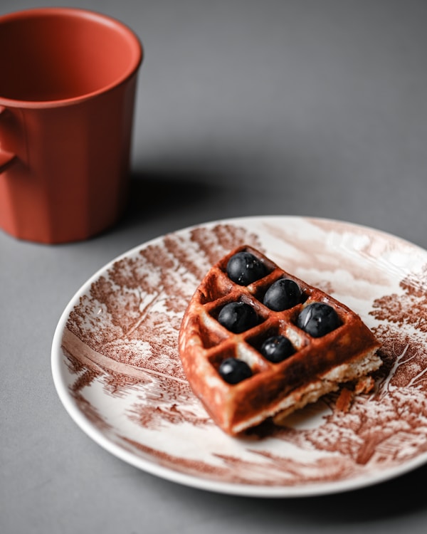 Chocolate cookies on white and blue floral ceramic plate