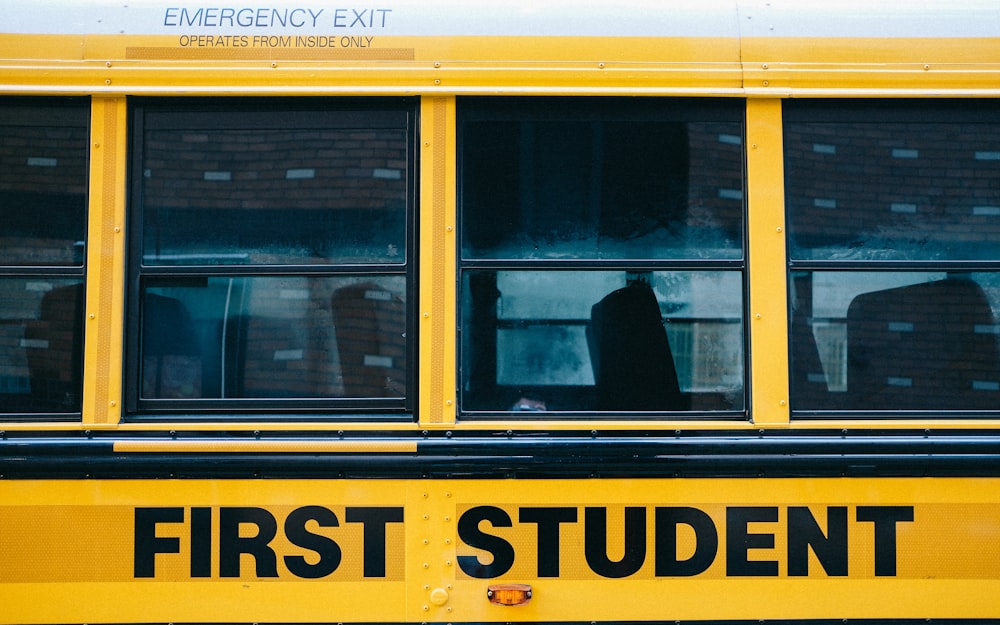 yellow school bus with black and white penguin