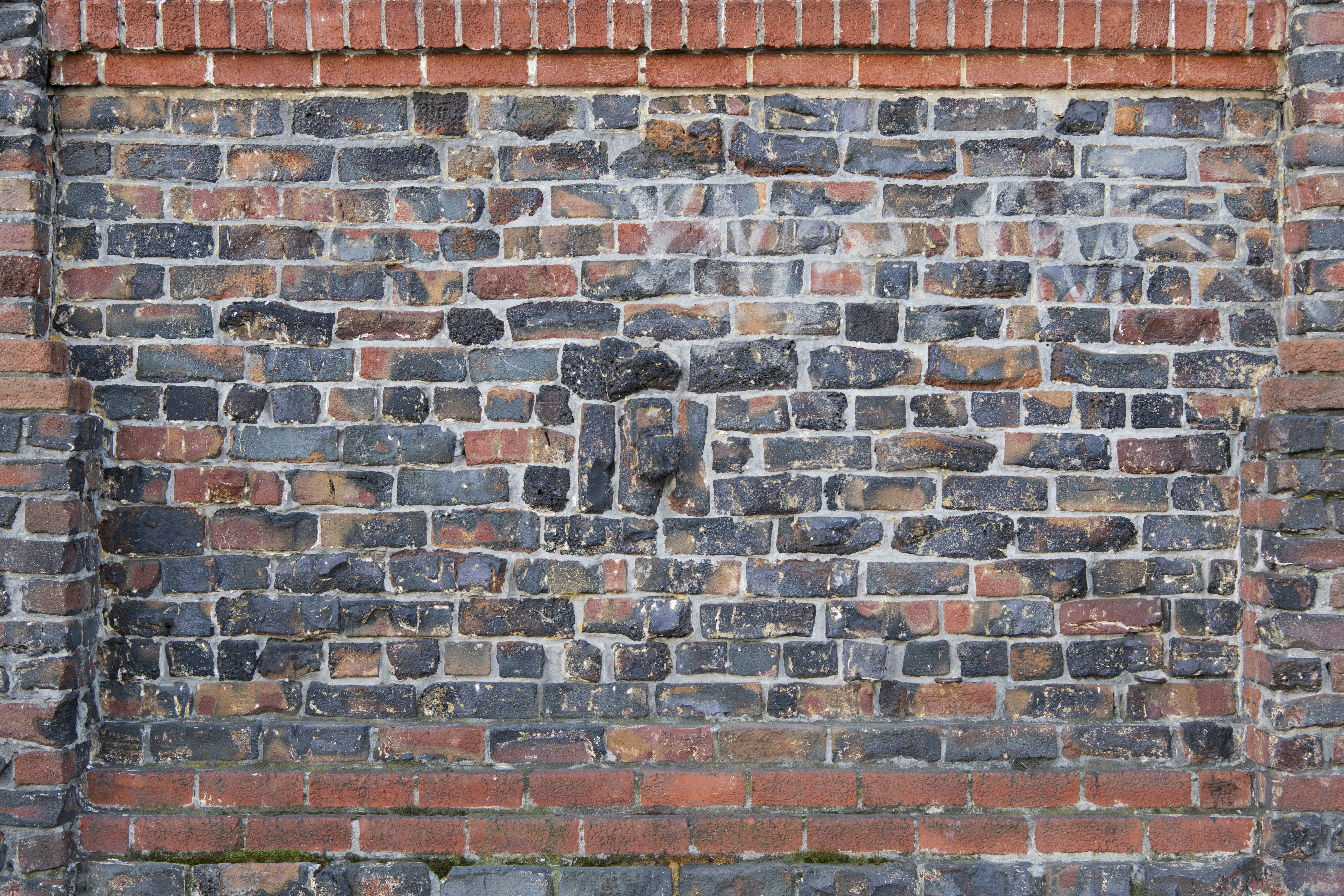 brown brick wall with black and white wall paint backdrop teams background