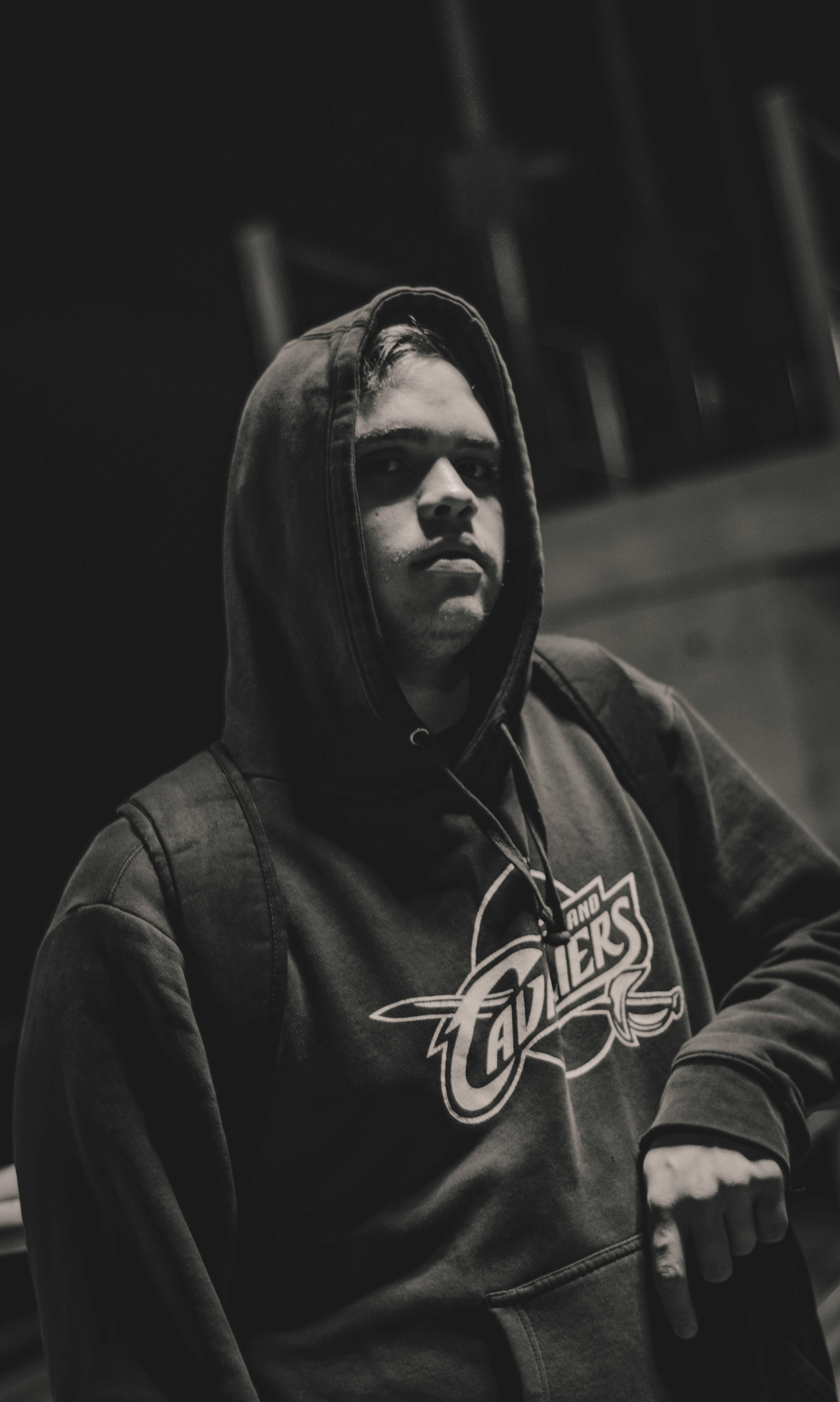 man in black hoodie in grayscale photography