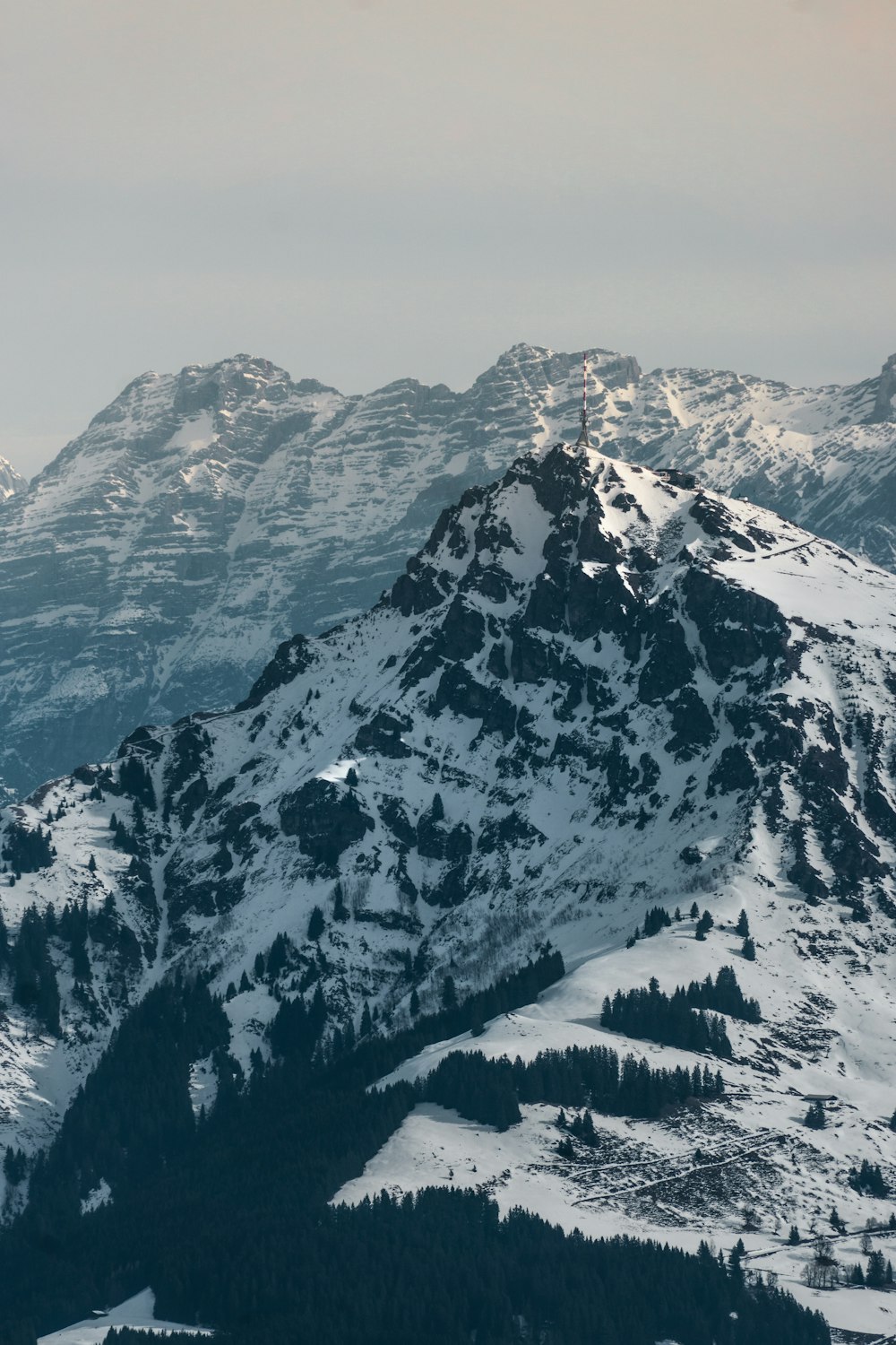 snow covered mountain during daytime