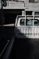 Behind-the-scenes shot of a photographer capturing truck details in natural light.
