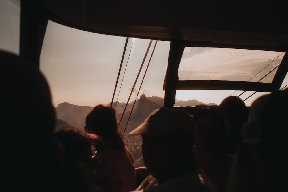 silhouette of people sitting on chair during sunset