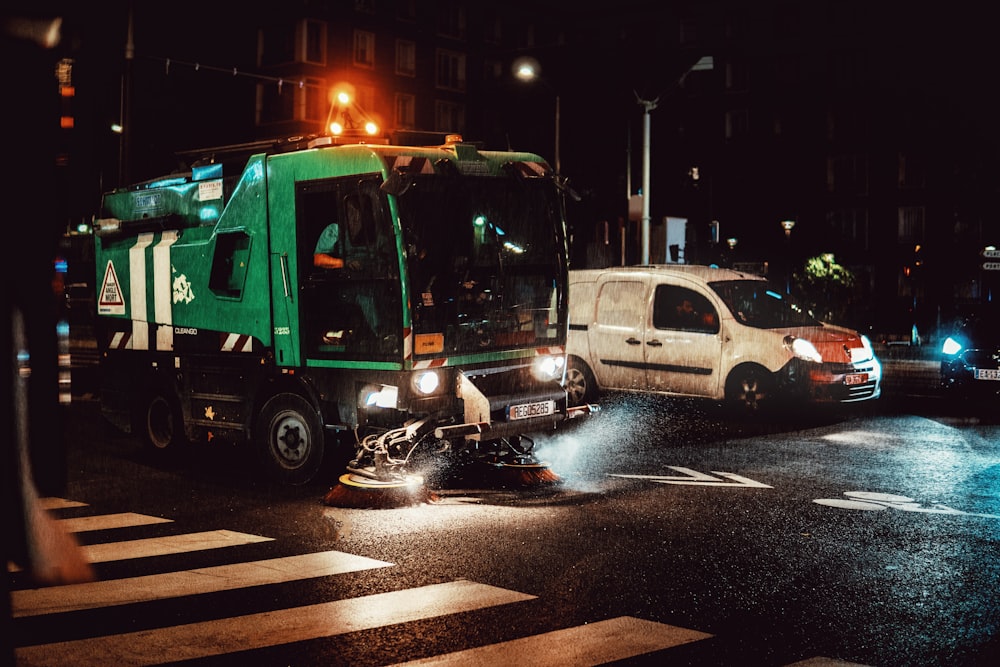 green truck on road during night time