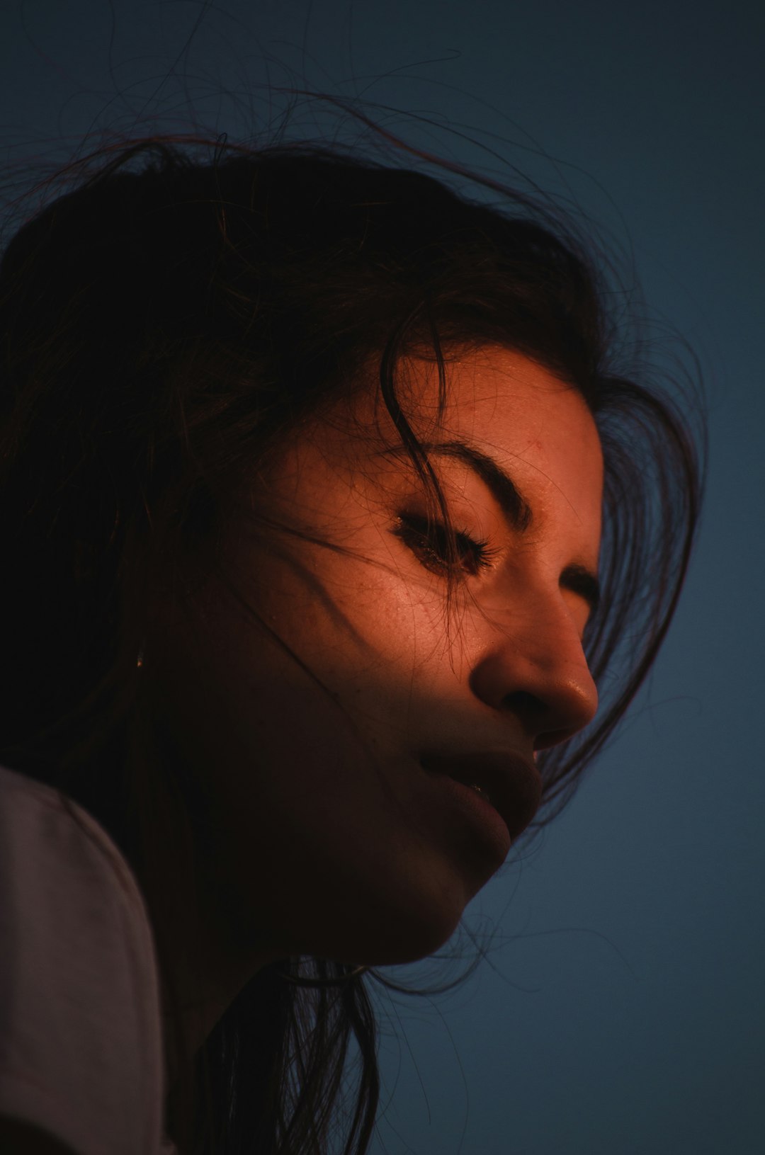 woman in white shirt with brown eyes