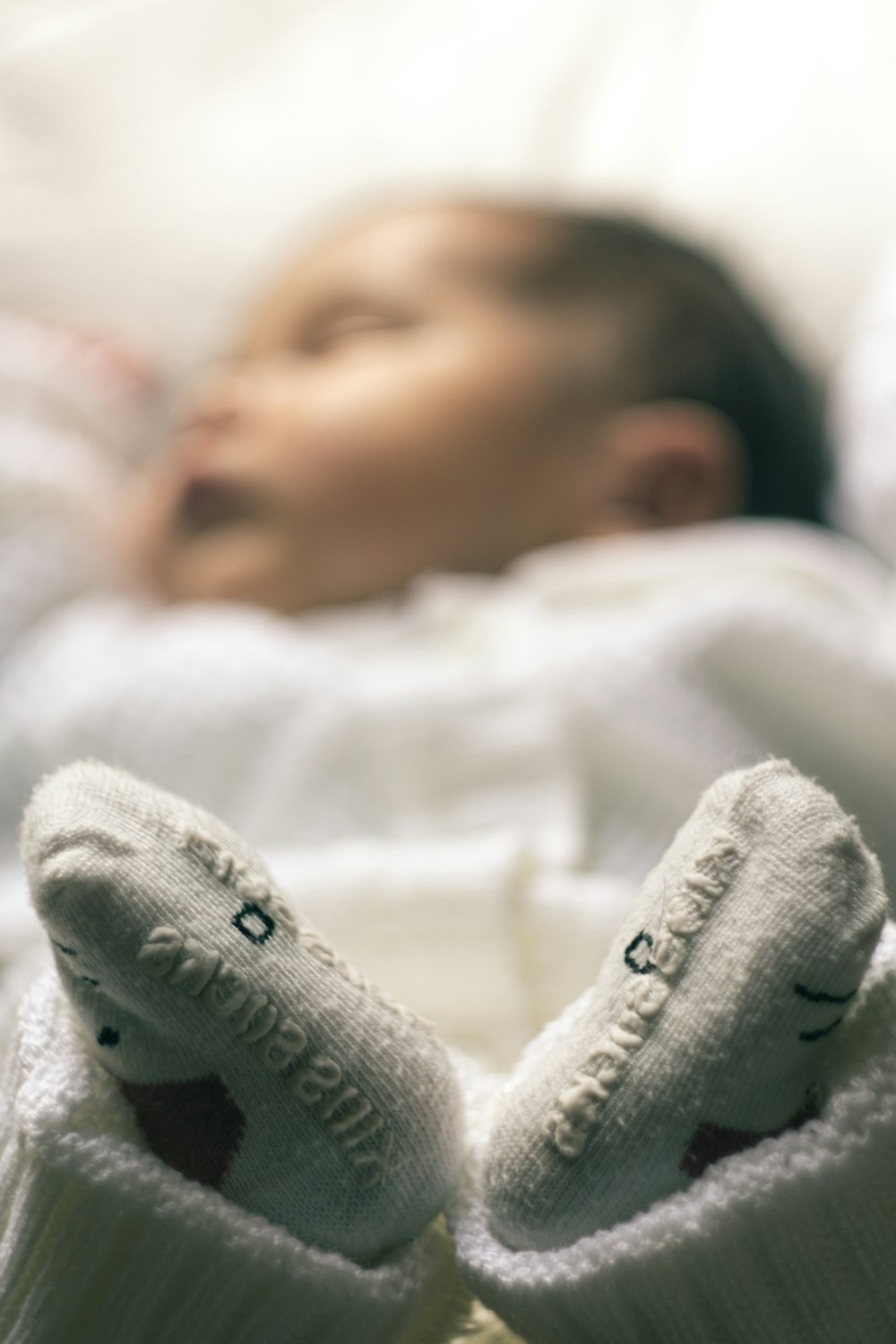 baby in white knit sweater