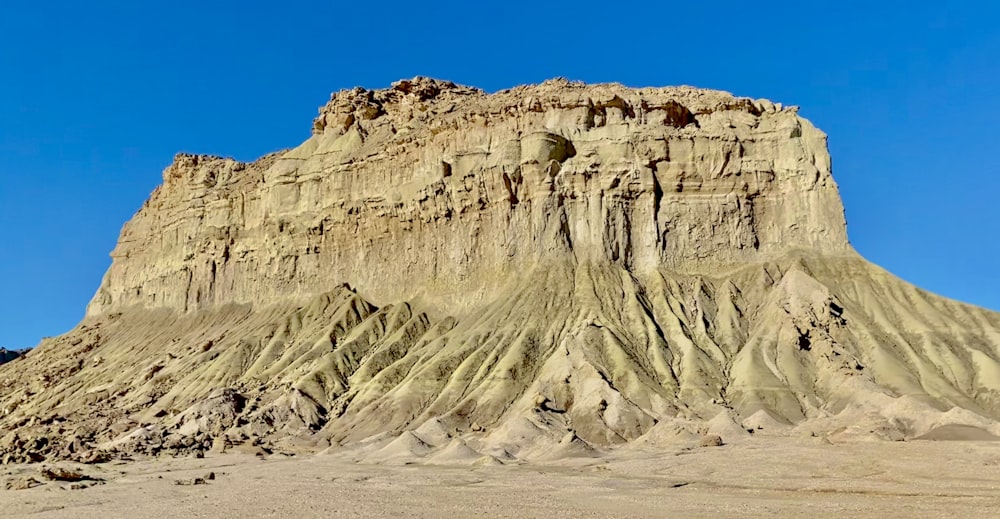 brown rocky mountain under blue sky during daytime