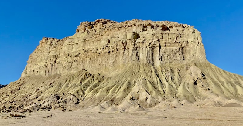 brown rocky mountain under blue sky during daytime