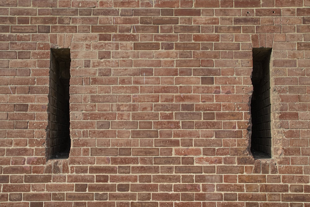 brown brick wall with black and white wall