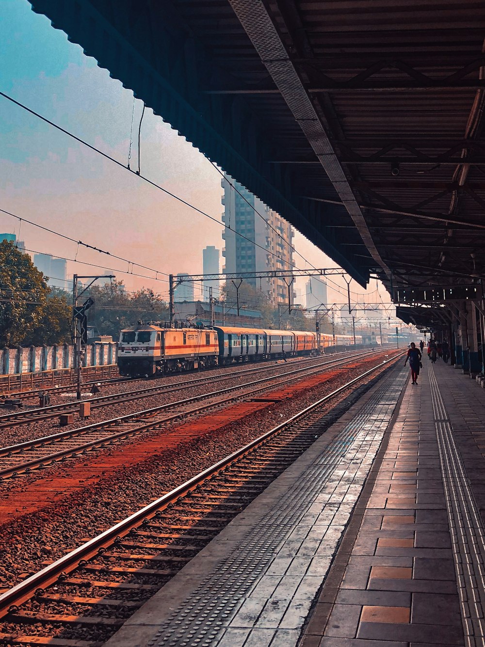 train on rail track during daytime