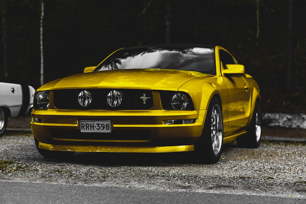 yellow chevrolet camaro on road