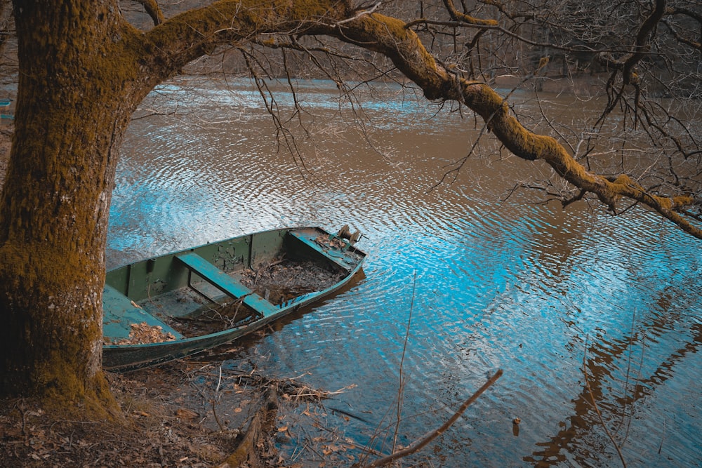 brown wooden boat on body of water during daytime