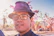 man in black framed eyeglasses and blue and white polka dot shirt