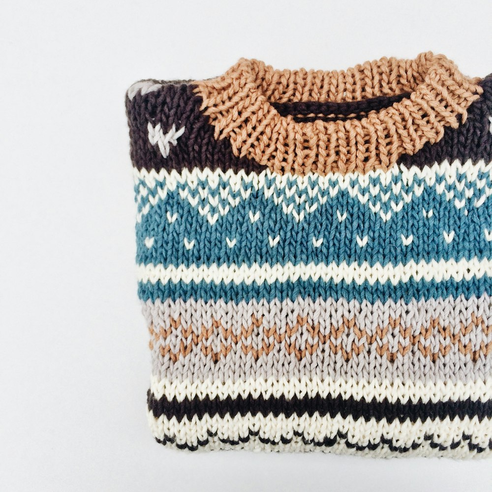white blue and brown knit sweater