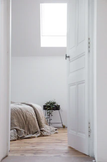 white bed linen on bed